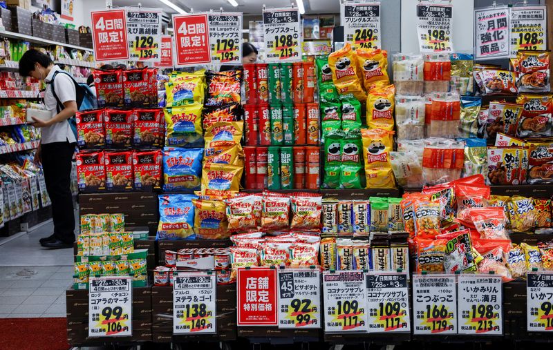 People shop for snacks at a confectionery store in Tokyo, Japan, July 28, 2026. REUTERS/Manami Yamada