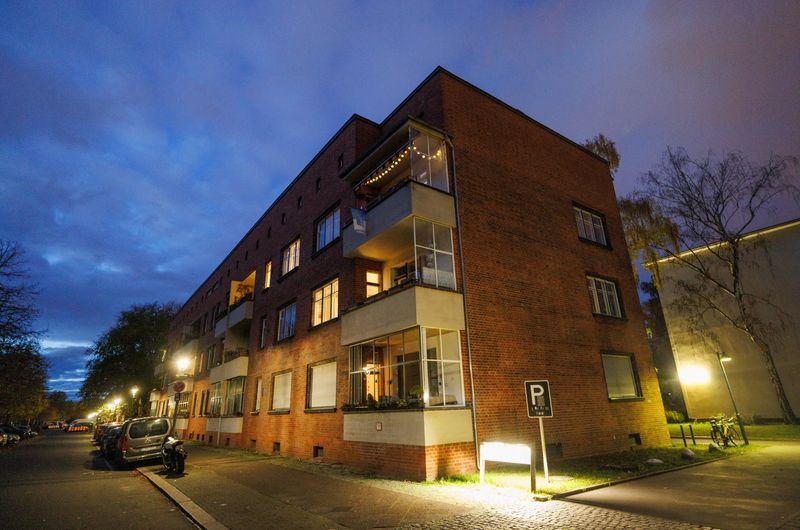 Flats are illuminated inside an apartment block of the residential estate Schillerpark, owned by Berlin Wohngenossenschafts association of residential cooperatives in Berlin, Germany, November 10, 2023. REUTERS/Lisi Niesner