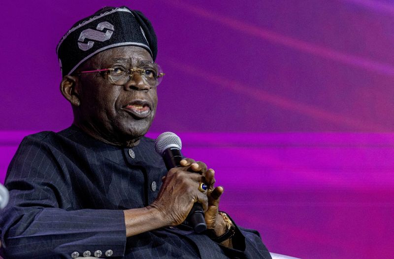 FILE PHOTO: Nigeria's president Bola Tinubu attends a panel discussion during the Africa CEO forum under the theme “The Scale Imperative: Why Africa Must Embrace Shared Ownership,” at the Kigali Convention Centre in Kigali, Rwanda, May 14, 2026. REUTERS/Jean Bizimana//File Photo