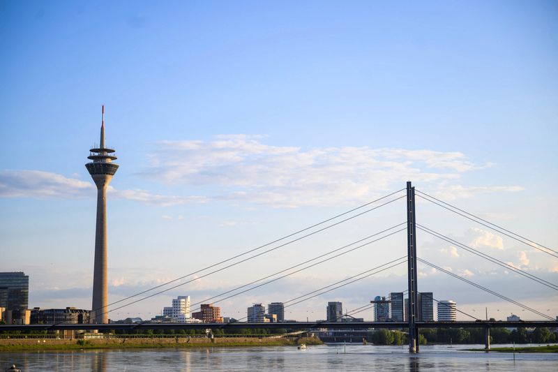 FILE PHOTO: A general view shows the river Rhine and the skyline including the Rheinturm and Rheinkniebruecke in Duesseldorf, Germany, May 13, 2024. REUTERS/Jana Rodenbusch/File Photo