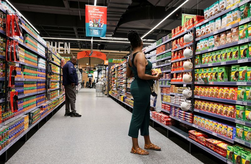 FILE PHOTO: Shoppers look for items as they shop at an outlet of retailer Checkers in Sandton City mall, in Sandton, South Africa, August 28, 2024. REUTERS/Lelethu Madikane/File Photo