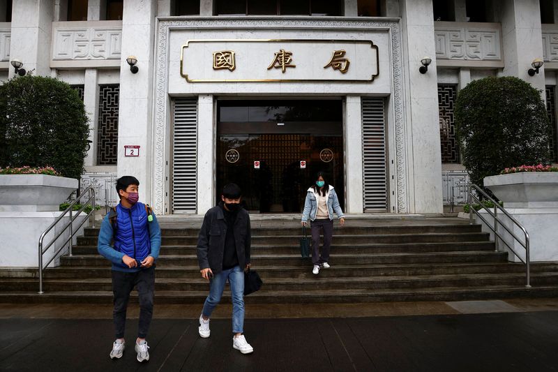 People leaving Taiwan's central bank in Taipei, Taiwan, December 14, 2022. REUTERS/Ann Wang/ File Photo