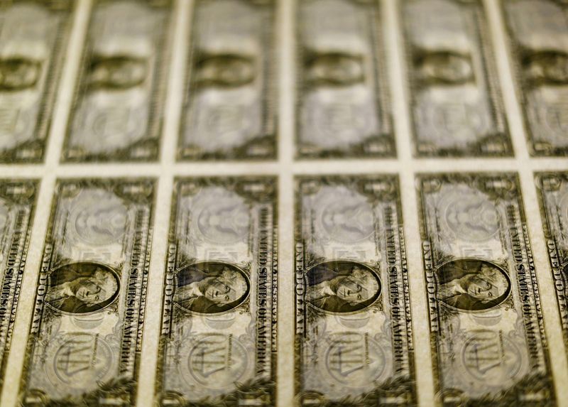 FILE PHOTO: U.S. dollar bills are seen on a light table at the Bureau of Engraving and Printing in Washington, November 14, 2014. REUTERS/Gary Cameron/File Photo