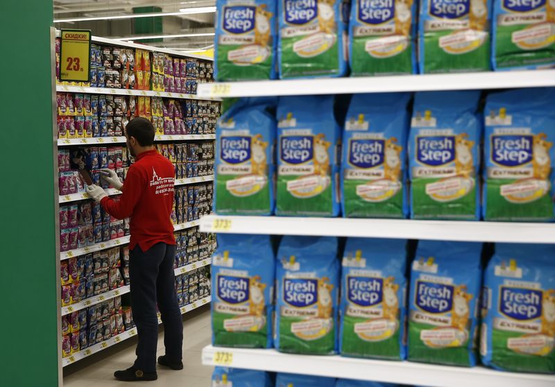 An employee sorts products at a grocery store which is the 100th store of French retail group Auchan opened in the country, in Moscow, Russia, December 13, 2016.  REUTERS/Maxim Shemetov