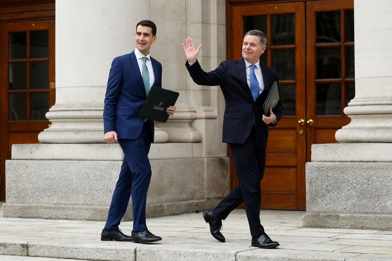 Ireland's Minister for Public Expenditure, Infrastructure, Public Service Reform and Digitalisation Jack Chambers and Minister for Finance Paschal Donohoe arrive to present the Budget 2026 documents in the courtyard of the Government Buildings, in Dublin, Ireland, October 7, 2025. REUTERS/Clodagh Kilcoyne