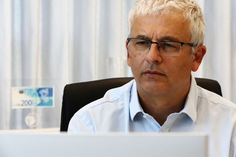 Bank of Israel Deputy Governor Andrew Abir poses for a picture in his office in Jerusalem July 8, 2020. REUTERS/Ammar Awad