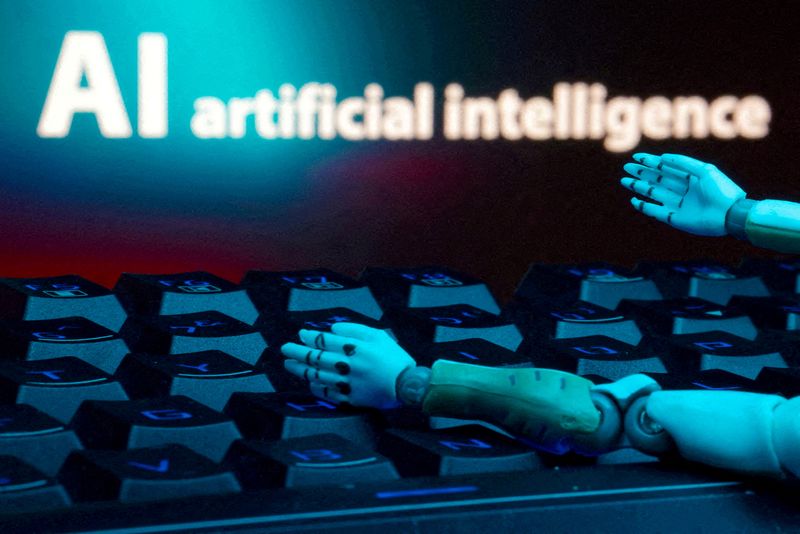 FILE PHOTO: A message reading "AI artificial intelligence," a keyboard and robot hands are seen in this illustration created on January 27, 2025. REUTERS/Dado Ruvic/Illustration/File Photo/File Photo