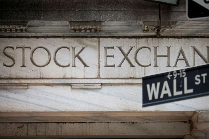 FILE PHOTO: FILE PHOTO: The Wall Street entrance to the New York Stock Exchange (NYSE) is seen in New York City, U.S., November 15, 2022. REUTERS/Brendan McDermid/File Photo/File Photo