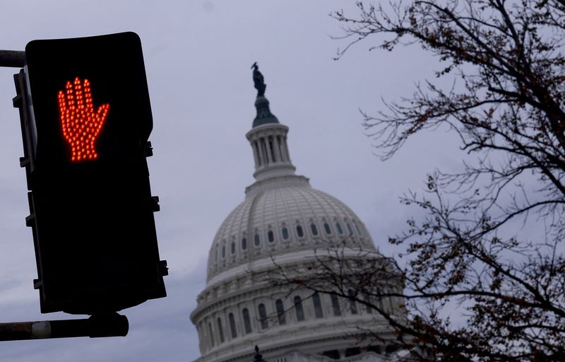 A "Do not cross" sign is illuminated at a crosswalk outside of U.S. Capitol building in Washington, US, November 10, 2024. REUTERS/Hannah McKay