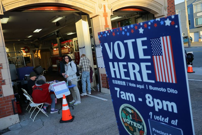 Voters arrive at a polling station in a fire station during California's special election on Proposition 50, a measure that would temporarily redraw congressional districts, in San Francisco, California, U.S., November 4, 2025. REUTERS/Carlos Barria