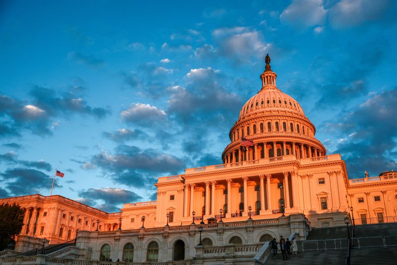 The setting sun illuminates the U.S. Capitol building in Washington, D.C., U.S., December 2, 2025. REUTERS/Evelyn Hockstein