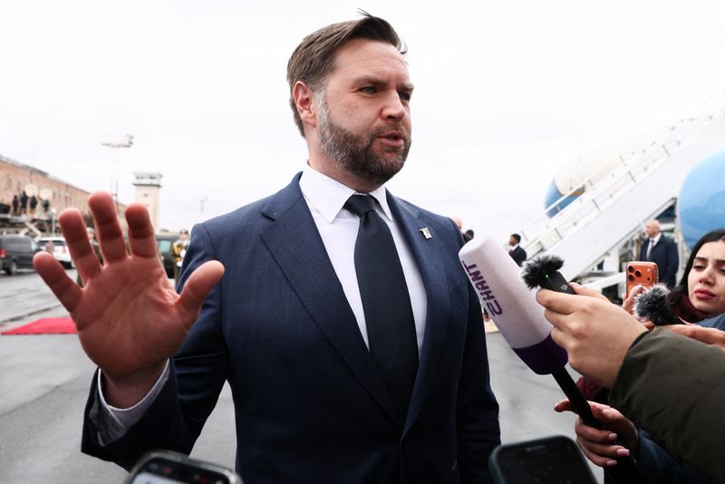 U.S. Vice President JD Vance speaks to the media before boarding Air Force Two upon departure for Azerbaijan, at Zvartnots International Airport in Yerevan, Armenia, February 10, 2026. REUTERS/Kevin Lamarque/Pool