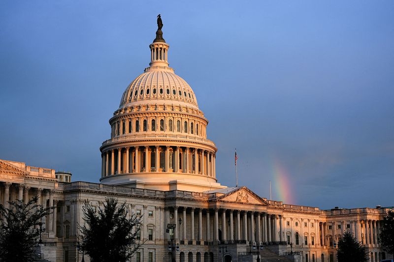 A rainbow is visible in the clouds behind the Capitol Building, in Washington, D.C., U.S., October 18, 2025. REUTERS/Aaron Schwartz