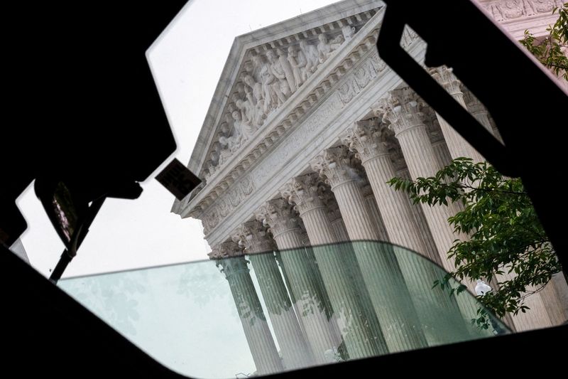 FILE PHOTO: The U.S. Supreme Court as seen through the window of a security vehicle on the day justices are expected to issue orders in pending appeals, in Washington, D.C., U.S., June 29, 2026.  REUTERS/Cheney Orr/File Photo