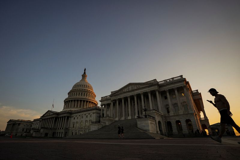 Sunlight falls on the U.S. Capitol as the sun sets, following a vote on the Sunshine Protection Act, which would make daylight saving time permanent, and states with areas exempt from daylight saving time may choose the standard time for those areas, in Washington, D.C., U.S., July 13, 2026. REUTERS/Al Drago