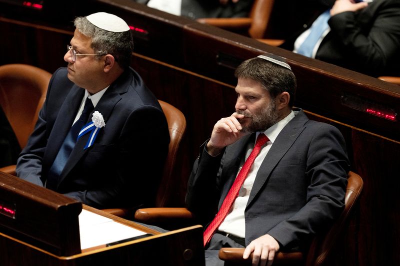 FILE PHOTO: Far-right Israeli lawmakers Itamar Ben Gvir, center, and Bezalel Smotrich, right, attend the swearing-in ceremony for the new Israeli parliament, at the Knesset, or parliament, in Jerusalem, November 15, 2022. Maya Alleruzzo/Pool via REUTERS/ File Photo