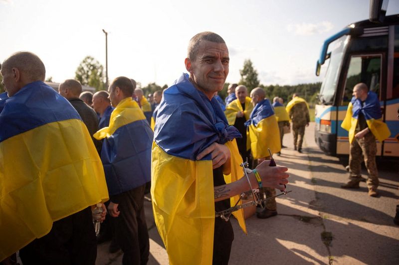 A Ukrainian prisoner of war (POWs) looks on as he stands witgh others after a swap, amid Russia's attack on Ukraine, at an unknown location in Ukraine, in this handout picture released June 10, 2025. Ukrainian Presidential Press Service/Handout via REUTERS