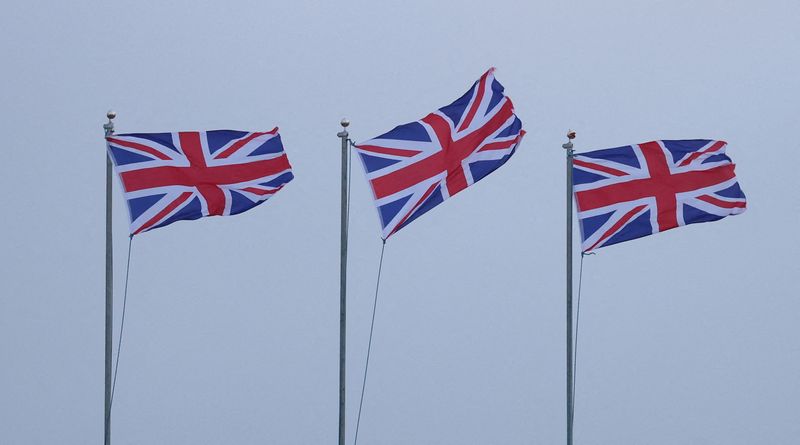 FILE PHOTO: Union Jack flags blow in strong winds brought by Storm Lilian outside Fort Perch Rock in New Brighton, Britain, August 23, 2024. REUTERS/Phil Noble/File photo