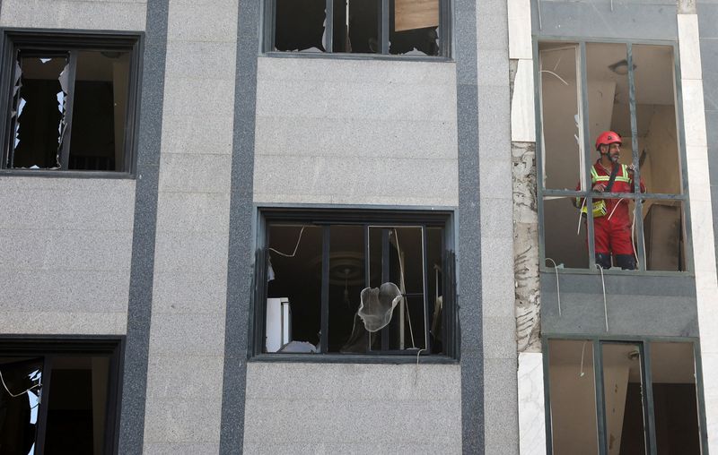A rescuer looks out from a damaged building in the aftermath of Israeli strikes, in Tehran, Iran, June 13, 2025. Majid Asgaripour/WANA (West Asia News Agency) via REUTERS