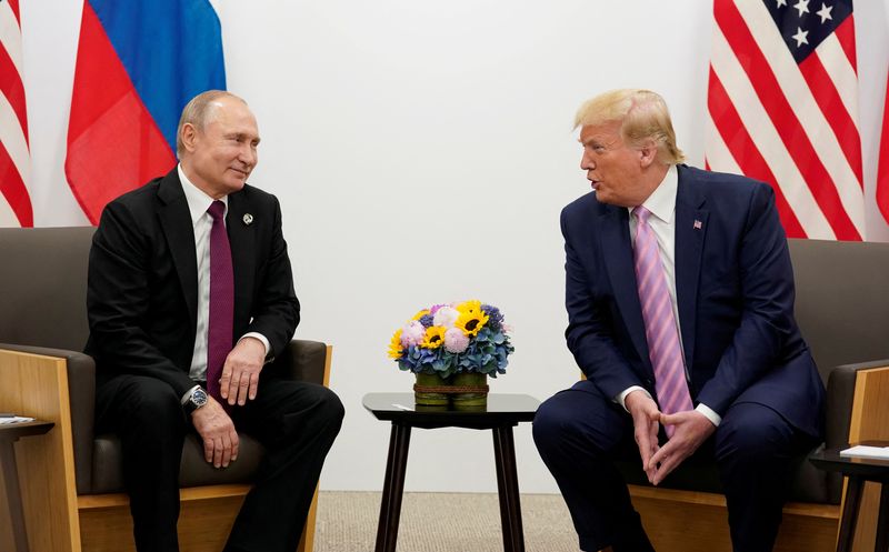 FILE PHOTO: Russia's President Vladimir Putin and U.S. President Donald Trump talk during a bilateral meeting at the G20 leaders summit in Osaka, Japan, June 28, 2019.  REUTERS/Kevin Lamarque/File Photo