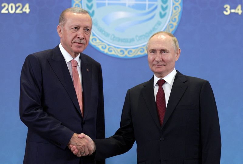 FILE PHOTO: Russian President Vladimir Putin shakes hands with Turkish President Tayyip Erdogan during a meeting on the sidelines of the Shanghai Cooperation Organization (SCO) summit in Astana, Kazakhstan July 3, 2024. Sputnik/Gavriil Grigorov/Pool via REUTERS/ File Photo