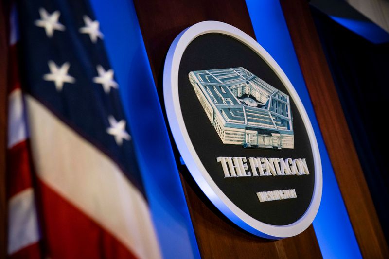 The Pentagon logo is seen behind the podium in the briefing room at the Pentagon in Arlington, Virginia, U.S., January 8, 2020. REUTERS/Al Drago/File Photo