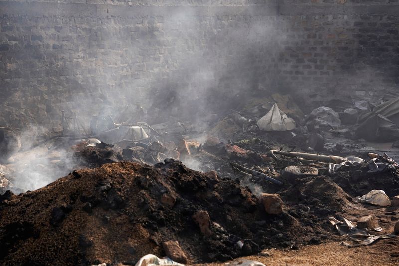 Burnt grains and farming equipment sit inside a storehouse following a deadly gunmen attack in Yelwata, Benue State, Nigeria, June 16, 2025. REUTERS/Marvellous Durowaiye