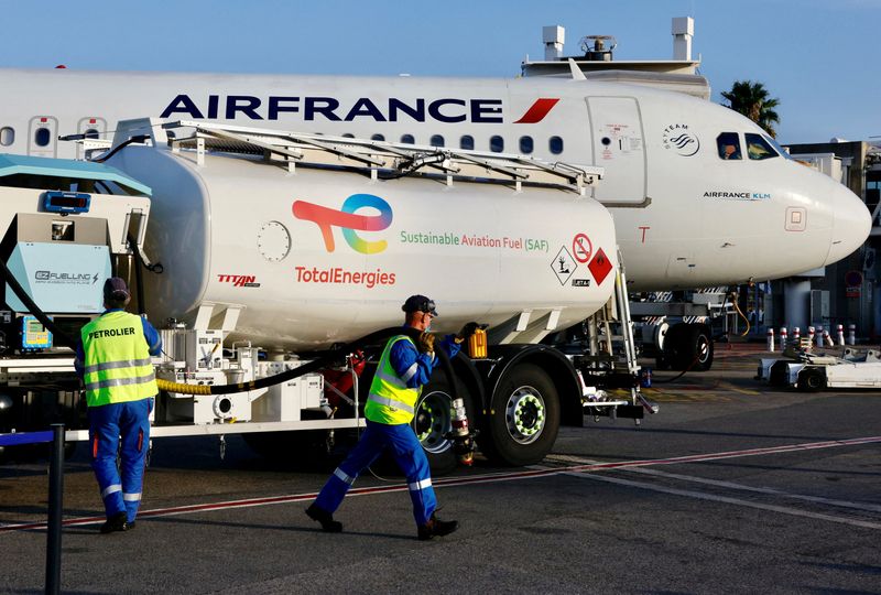 FILE PHOTO: An Air France aircraft, operated with sustainable aviation fuel (SAF) produced by TotalEnergies, refuels before its first flight from Nice to Paris at Nice airport, France, October 1, 2021.  REUTERS/Eric Gaillard/File Photo