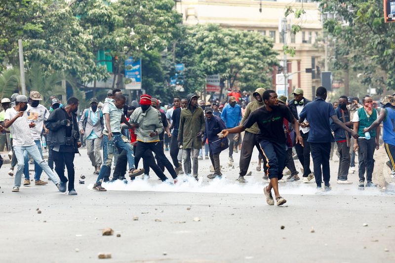 FILE PHOTO: A protester throws a projectile during a demonstration over the death of Kenyan blogger Albert Ojwang in police custody, in downtown Nairobi, Kenya June 17, 2025. REUTERS/Thomas Mukoya/File photo