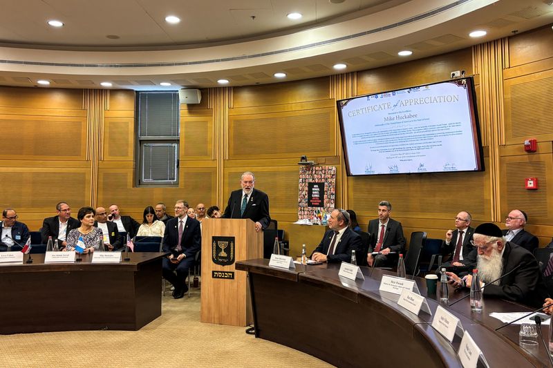 FILE PHOTO: U.S. Ambassador to Israel Mike Huckabee speaks at an event at the Knesset, Israel's parliament, as part of Jerusalem day celebrations and in honour of all the countries that moved their embassies to Jerusalem May 28, 2025 REUTERS/Steven Scheer/File photo