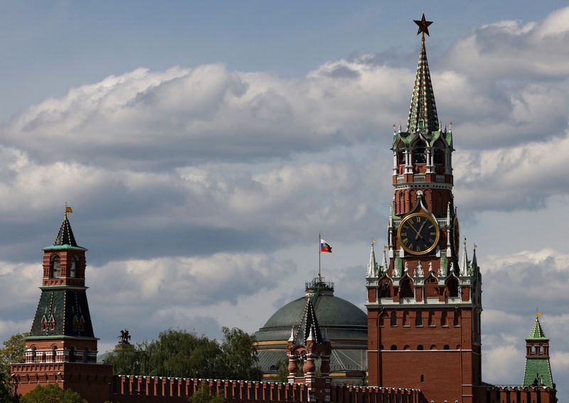 FILE PHOTO: The Russian flag flies on the dome of the Kremlin Senate building behind Spasskaya Tower, in central Moscow, Russia, May 4, 2023. REUTERS/Stringer/File photo