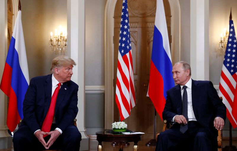 FILE PHOTO: U.S. President Donald Trump meets with Russian President Vladimir Putin in Helsinki, Finland, July 16, 2018.     REUTERS/Kevin Lamarque/File Photo
