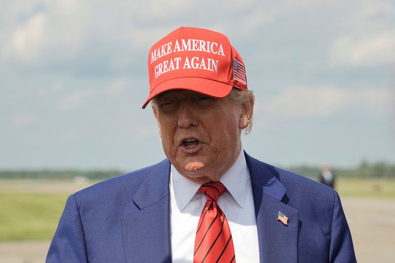 FILE PHOTO: U.S. President Donald Trump talks to reporters upon his arrival at Morristown Municipal Airport in Morristown, New Jersey, U.S., June 20, 2025. REUTERS/Ken Cedeno/File Photo