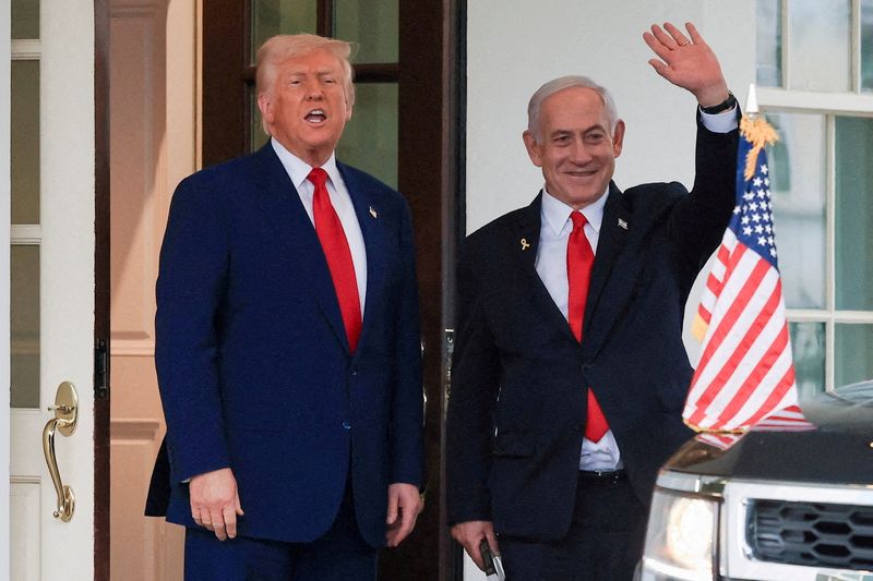 U.S. President Donald Trump speaks as Israeli Prime Minister Benjamin Netanyahu waves following a meeting in the White House, in Washington, U.S., April 7, 2025. REUTERS/Kevin Mohatt