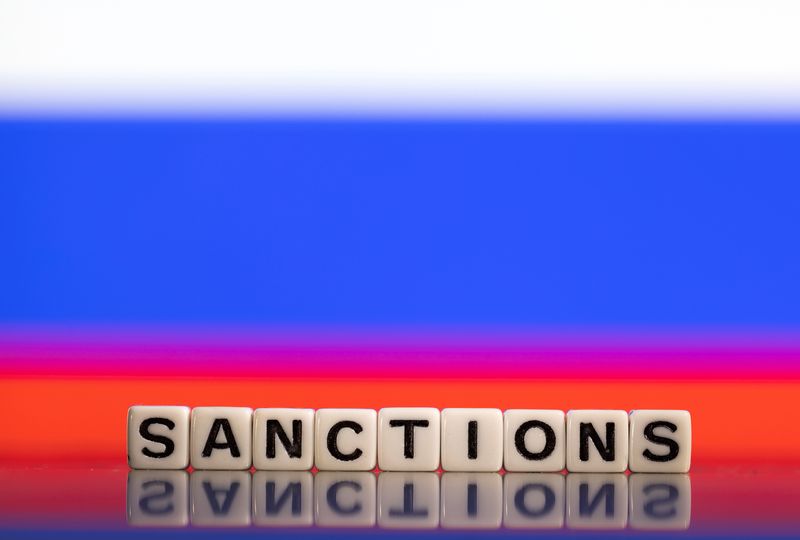 FILE PHOTO: Plastic letters arranged to read "Sanctions" are placed in front of Russian flag colors in this illustration taken February 25, 2022. REUTERS/Dado Ruvic/Illustration/ File Photo
