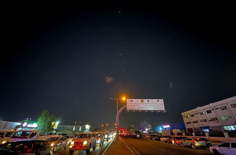 Traces are seen in the sky after Iran's armed forces say they targeted The Al-Udeid base in a missile attack, in Qatar, June 23, 2025. REUTERS/Stringer