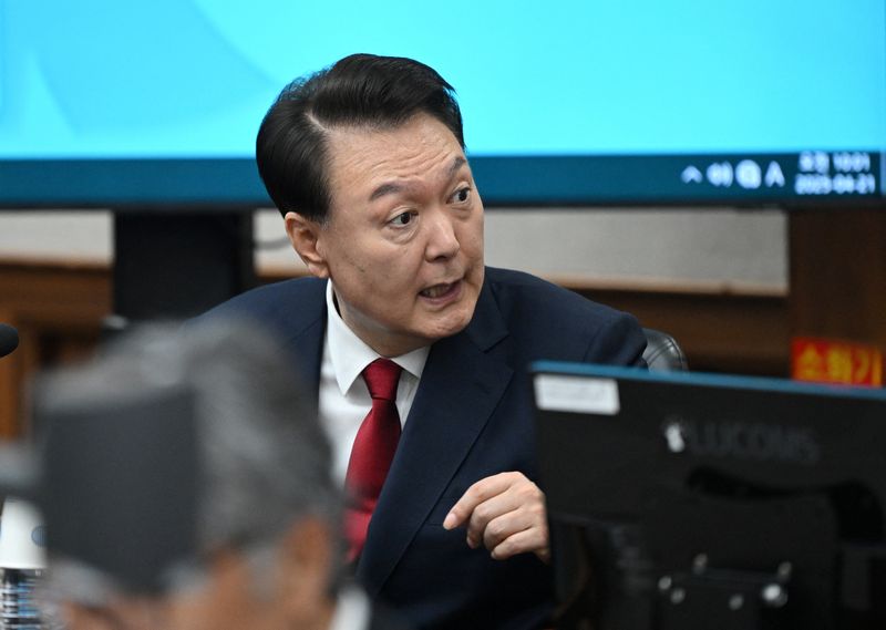 FILE PHOTO: South Korea's former president Yoon Suk Yeol attends his criminal trial on insurrection charges at a courtroom of the Seoul Central District Court in Seoul, South Korea on April 21, 2025. JUNG YEON-JE/Pool via REUTERS/ File Photo