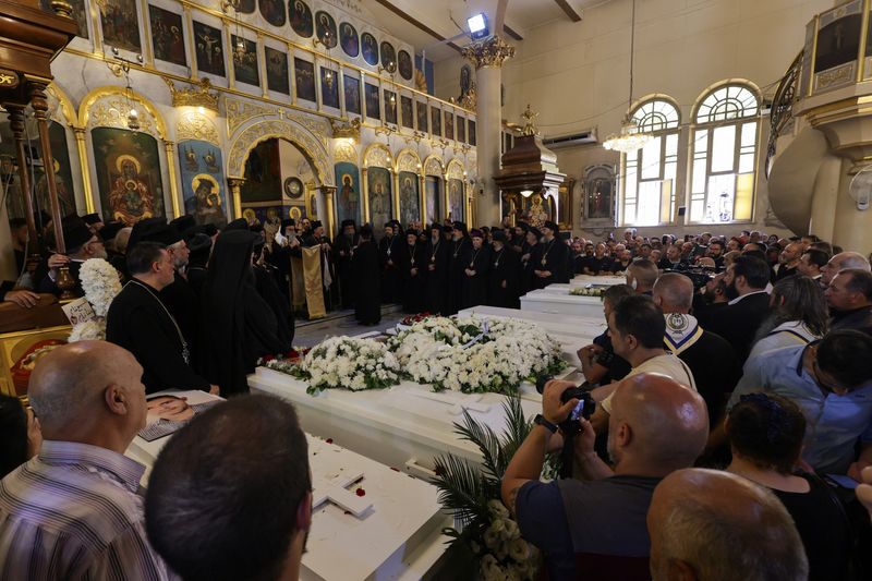 People attend the funeral of victims of a suicide bombing at the Mar Elias Church on Sunday, in Damascus, Syria, June 24, 2025. REUTERS/Khalil Ashawi