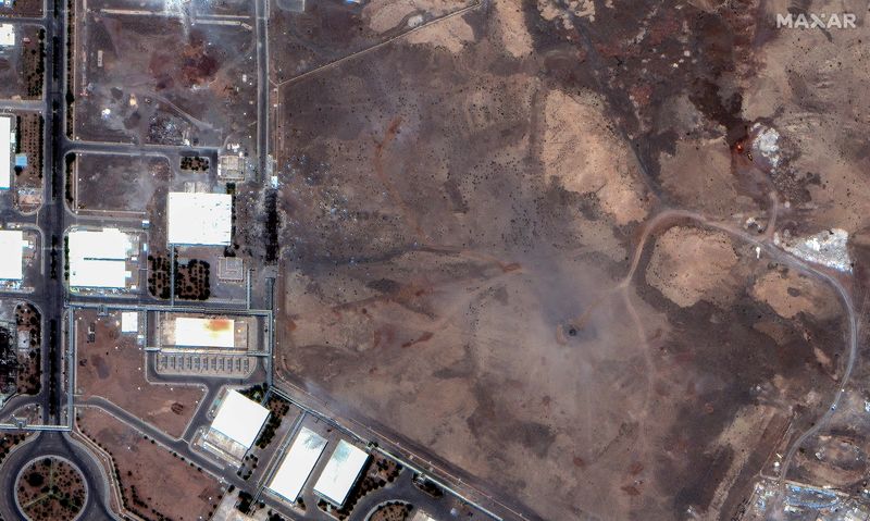 FILE PHOTO: A satellite image shows airstrike craters over the underground centrifuge halls of the Natanz Enrichment Facility, following U.S. airstrikes amid the Iran-Israel conflict, in Natanz County, Iran, June 22, 2025. Maxar Technologies/Handout via REUTERS/File Photo