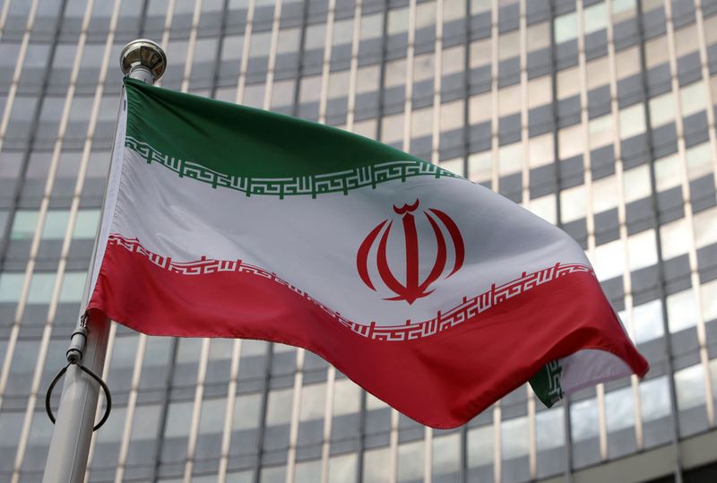 FILE PHOTO: The Iranian flag flutters in front of the International Atomic Energy Agency (IAEA) organisation's headquarters in Vienna, Austria, June 5, 2023. REUTERS/Leonhard Foeger/ File Photo