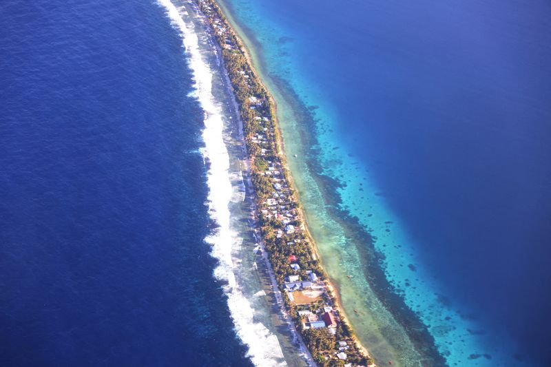 FILE PHOTO: Aerial view of Funafuti, Tuvalu’s most populous island, September 6, 2024. Picture taken through plane window. REUTERS/Kirsty Needham/File Photo