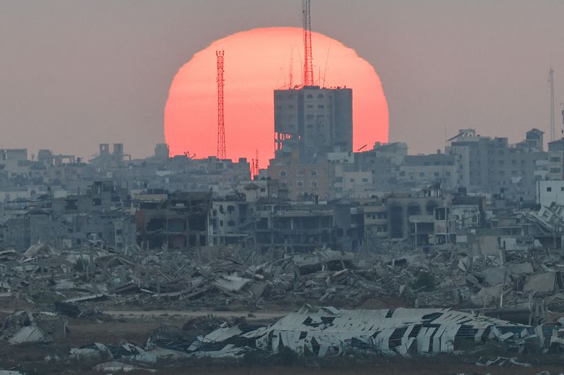 The sun sets over Gaza, as seen from Israel, July 1, 2025. REUTERS/Amir Cohen     TPX IMAGES OF THE DAY