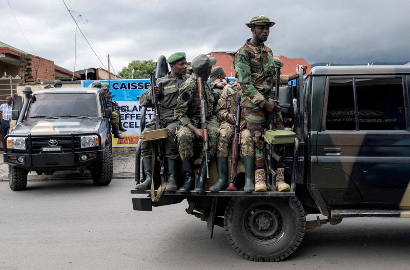 FILE PHOTO: Members of the M23 rebel group ride on their vehicles after the opening ceremony of Caisse Generale d'epargne du Congo in Goma, North Kivu province in the East of the Democratic Republic of Congo, April 7, 2025. REUTERS/Arlette Bashizi/File Photo