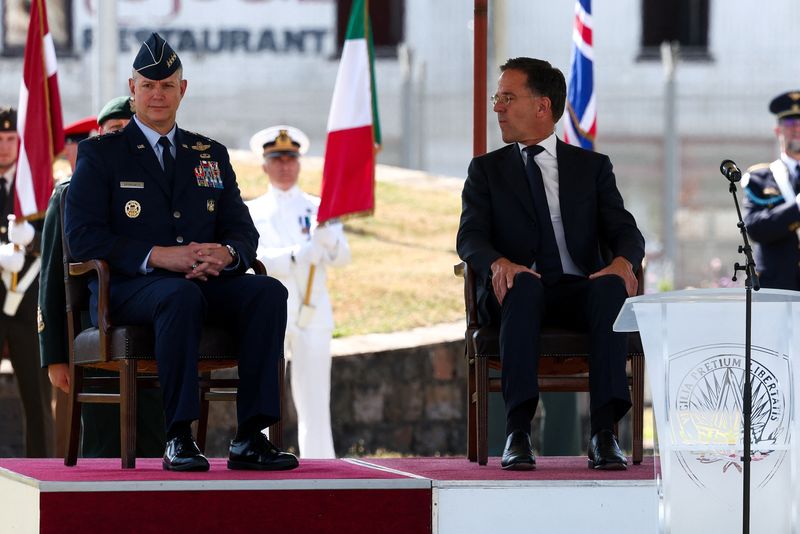 NATO Secretary General Mark Rutte and U.S. Air Force General Alexus Grynkewich attend a ceremony where Grynkewich takes over as NATO's new Supreme Allied Commander Europe (SACEUR), at the Supreme Headquarters Allied Powers Europe (SHAPE), in Casteau, Belgium July 4, 2025. REUTERS/Yves Herman