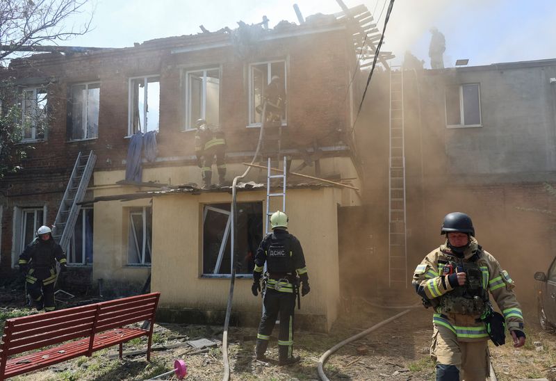 FILE PHOTO: Rescuers work at the site of the Russian drone strike, amid Russia's attack on Ukraine, in Kharkiv, Ukraine July 7, 2025. REUTERS/Vyacheslav Madiyevskyy/File Photo