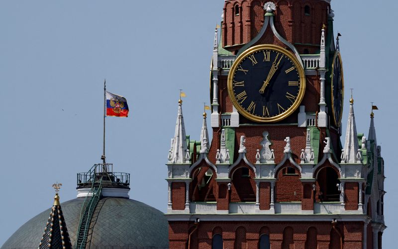 FILE PHOTO: The Russian flag flies on the dome of the Kremlin Senate building behind Spasskaya Tower in Moscow, Russia June 2, 2025. REUTERS/Evgenia Novozhenina/File Photo