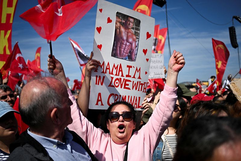 FILE PHOTO: People take part in a rally to protest against the arrest of Istanbul Mayor Ekrem Imamoglu as part of a corruption investigation, in Istanbul, Turkey, March 29, 2025. REUTERS/Dylan Martinez/File Photo
