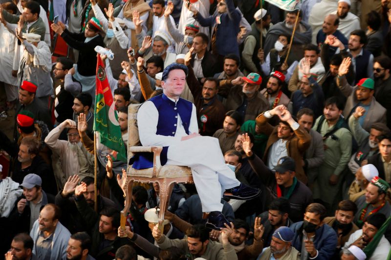 FILE PHOTO: Supporters of the former Pakistani Prime Minister Imran Khan's party, the Pakistan Tehreek-e-Insaf (PTI), carry a cutout of him, as they gather, to protest what they call a black day and a stolen mandate in last year's general election, during a rally in Swabi, Pakistan February 8, 2025. REUTERS/Salahuddin/File Photo