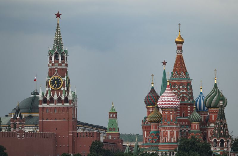 FILE PHOTO: A view of Kremlin's Spasskaya tower and St. Basil's Cathedral, during a stormy weather in Moscow, Russia July 14, 2025. REUTERS/Evgenia Novozhenina/File Photo