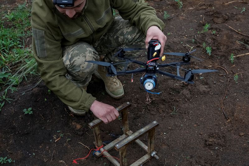 FILE PHOTO: Nazar, 33, a Ukrainian serviceman of the 72nd Chorni Zaporozhtsi Separate Mechanized Brigade of the Ukrainian Armed Forces, prepares a first-person view (FPV) drone to launch it towards Russian troops, during the unilaterally proposed three-day ceasefire declared by Russia, amid Russia's attack on Ukraine, near a frontline in Dnipropetrovsk region, Ukraine May 8, 2025. REUTERS/Alina Smutko/File Photo